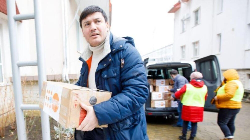 A man holds UNFPA supplies.