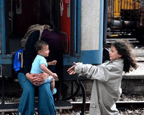 A Syrian family at a train yard.
