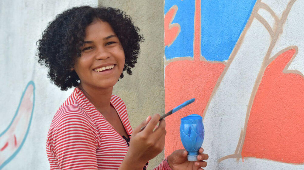 “Women are not alone”: Painting a colourful call to end gender-based violence in Brazil