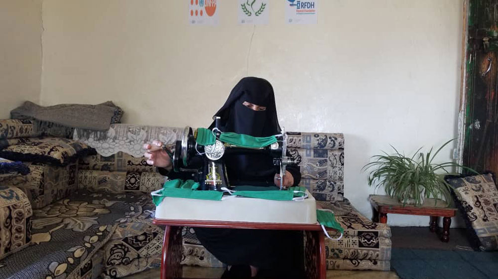 With Yemen’s health system approaching a breaking point, displaced women sew face masks to protect community