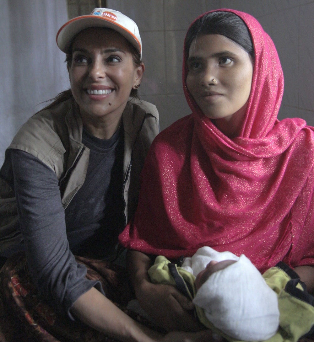 Goodwill Ambassador Catarina Furtado smiles with a new mother.