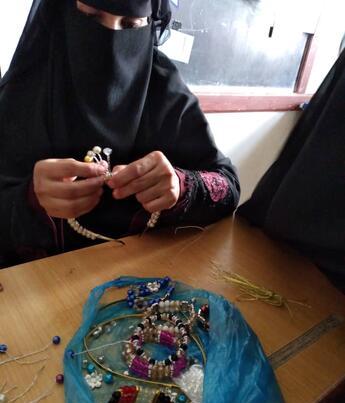 Woman making jewelry