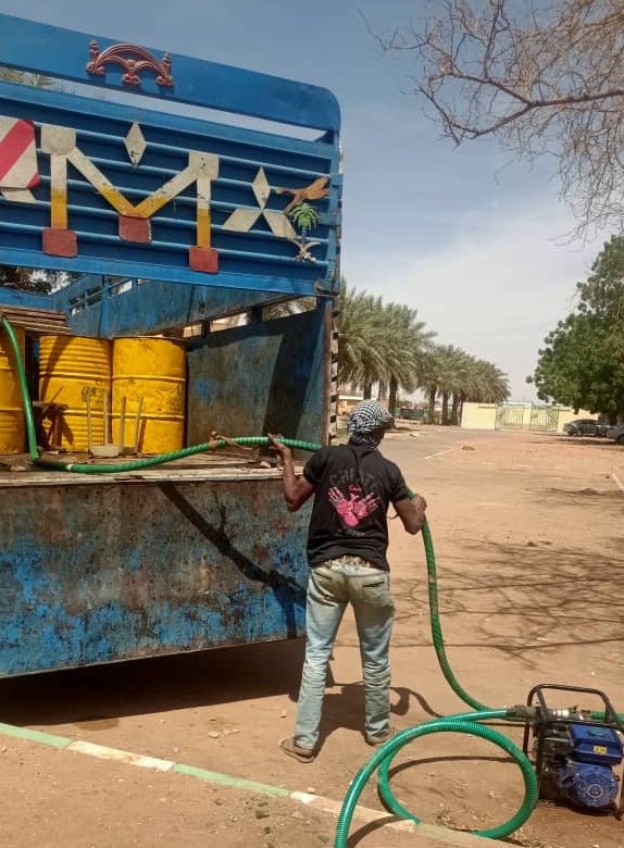 A man uses emergency fuel resources.