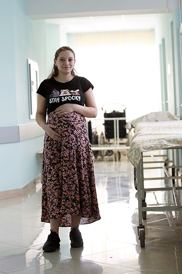 Pregnant woman stands in hospital in the Republic of Moldova 
