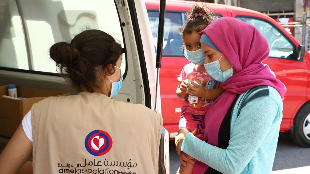 Beirut residents receive support from a mobile medical unit run by Amel Association, with support from UNFPA. 