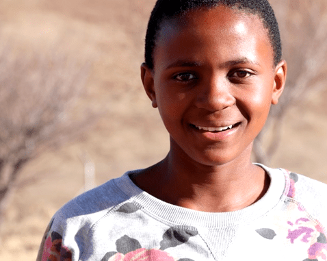 A smiling adolescent girl