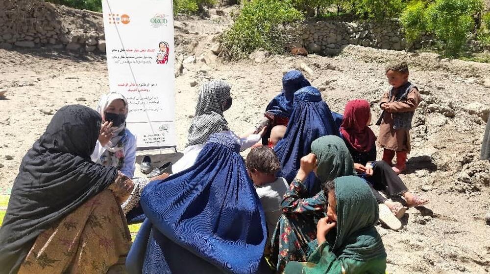 Midwife Habiba Danish and the mobile health team members speak with women and girls affected by the floods in northern Afghanistan. 