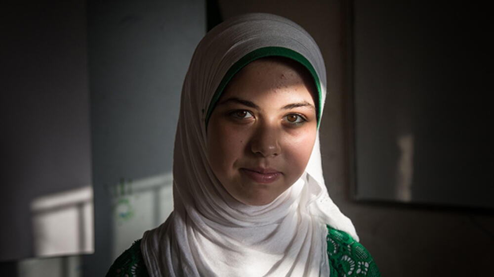 Raneem Abras, a Syrian refugee living in Lebanon, was approached about becoming a child bride. Her family refused, and instead she became an advocate against child marriage. © UNFPA Lebanon/Sima Diab