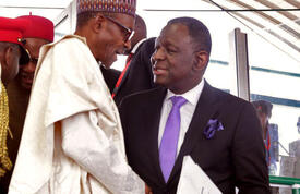 UNFPA Executive Director Dr. Babatunde Osotimehin shakes hands with His Excellency Muhammadu Buhari President of Nigeria.