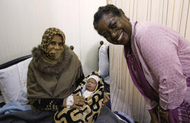 Dr. Natalia Kanem with Syrian mother at the Zaatari Maternity Clinic in Jordan. © UNFPA Jordan/Elspeth Dehnert